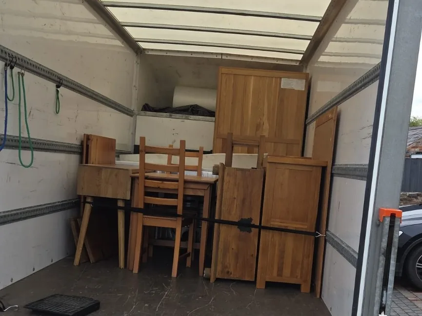 Dining furniture secured in a Luton van