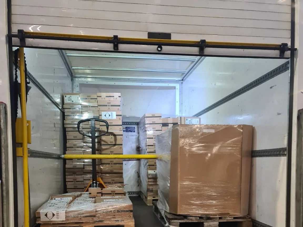 Commercial pallet delivery secured in a Luton van
